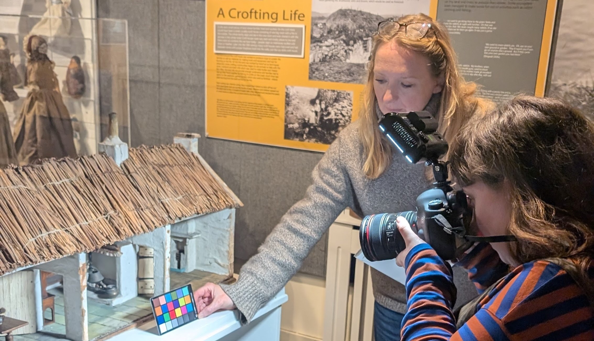 Eloise and Vicky from AY-PE (audiovisual design company) scanning items in the Highland Museum of Childhood in Strathpeffer.