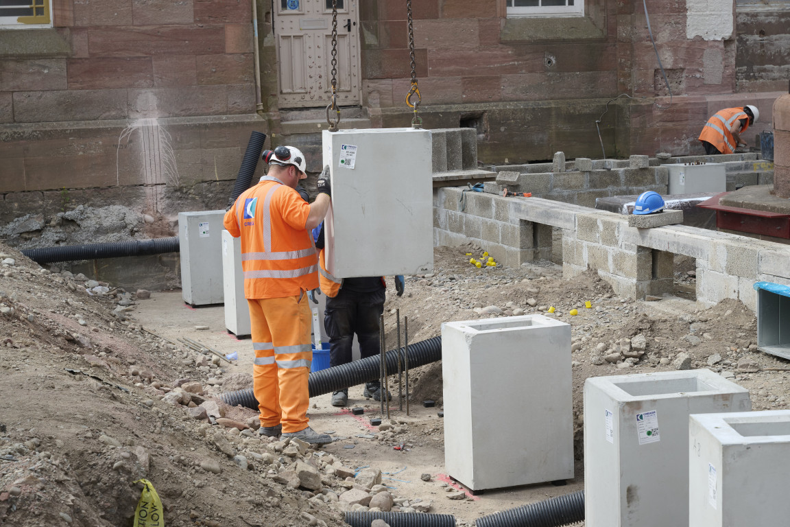 
    Installation of the permanent casing to hold the concrete columns
    