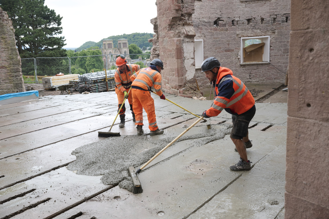 
    Brushes are used to fill the gaps with cement
    