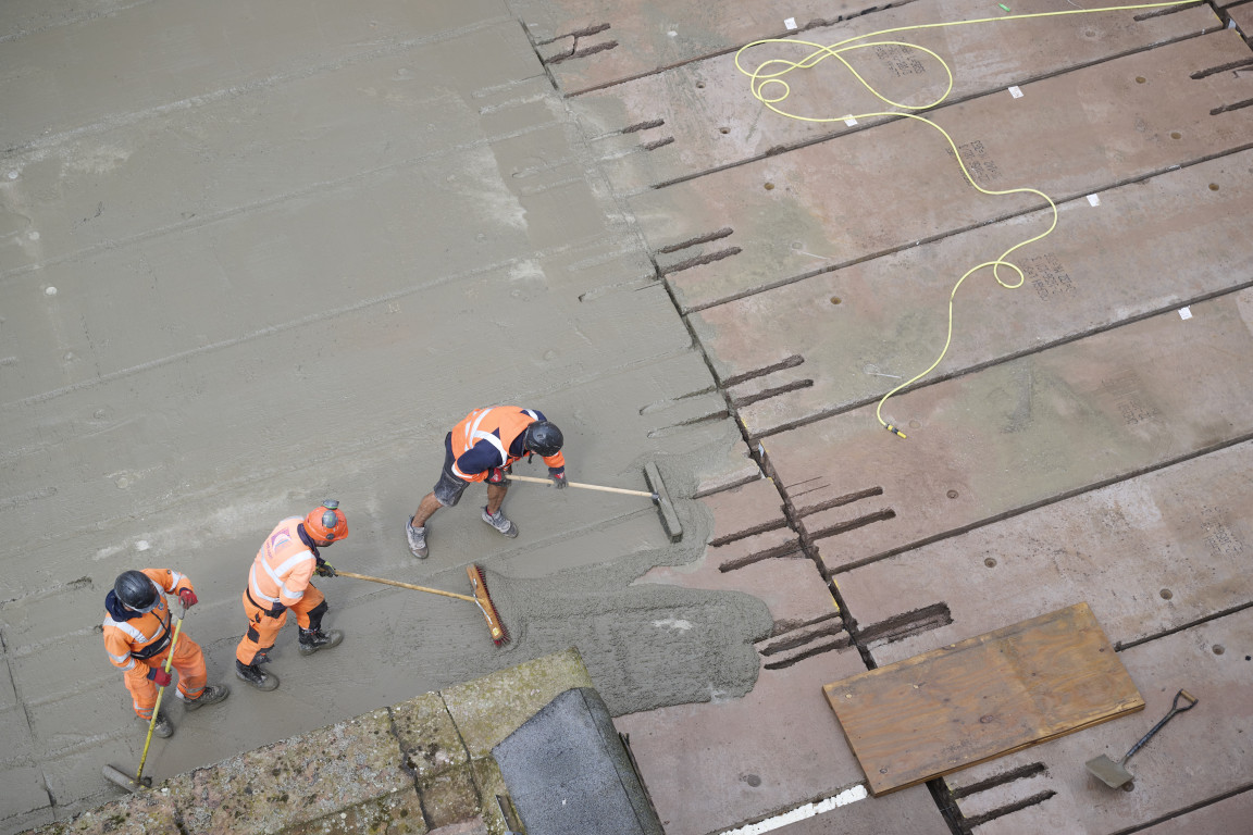 
    Brushes are used to fill the gaps with cement
    