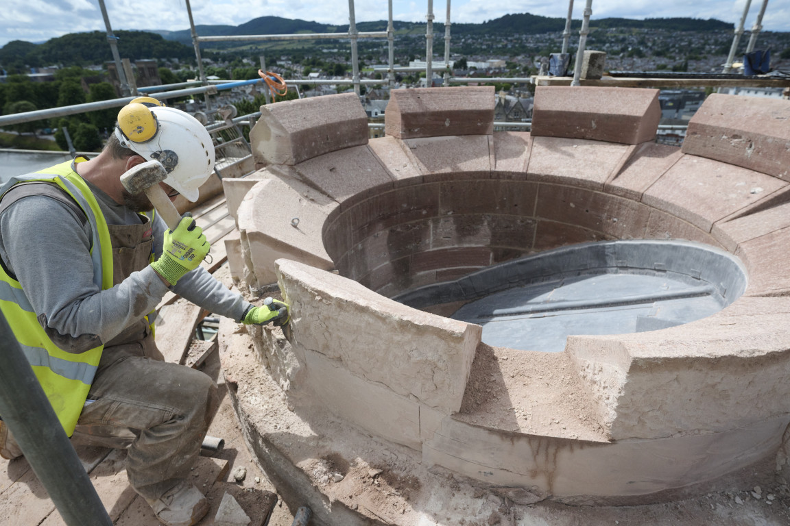 
    Masons replacing and maintaining stonework
    