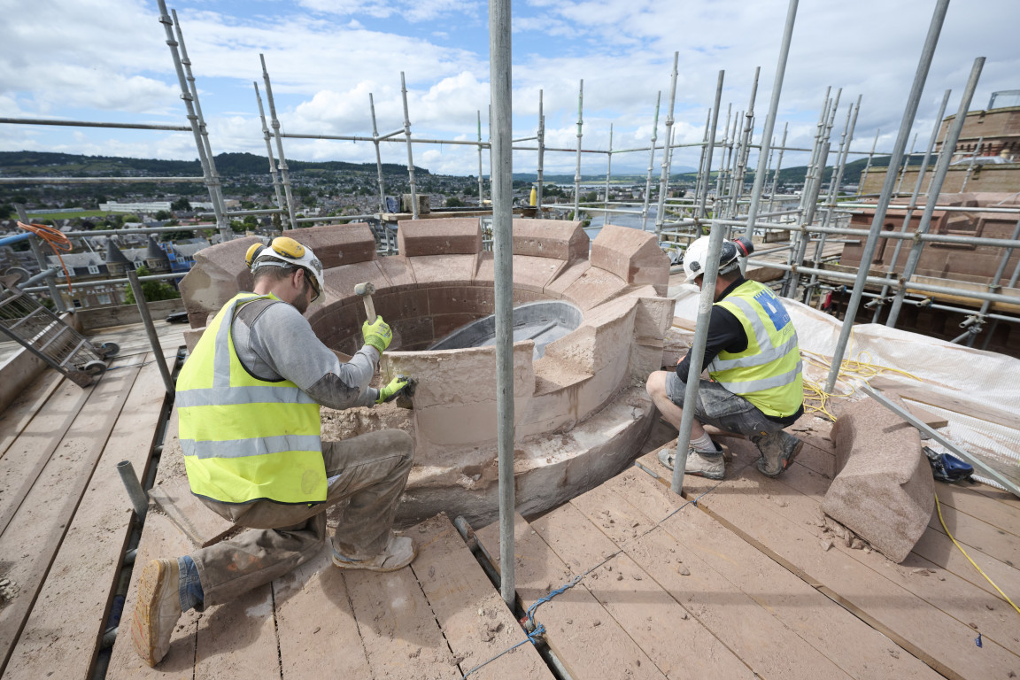 
    Masons replacing and maintaining stonework
    