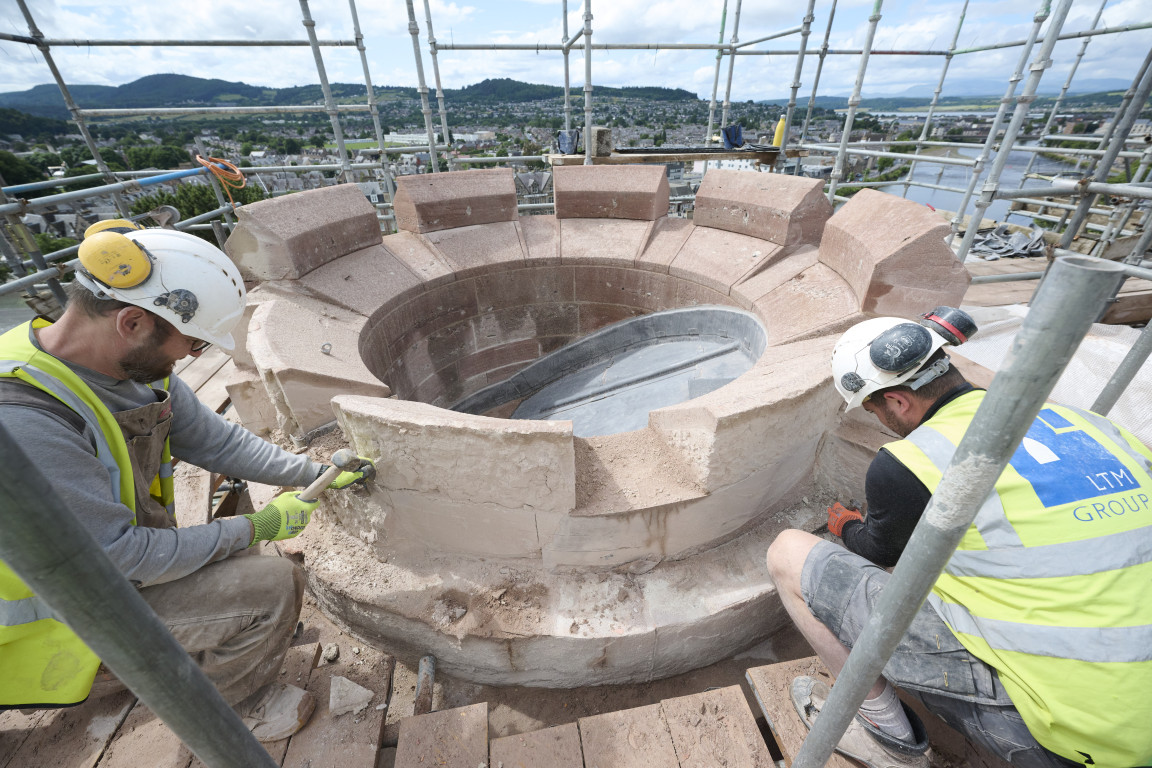 
    Masons replacing and maintaining stonework
    