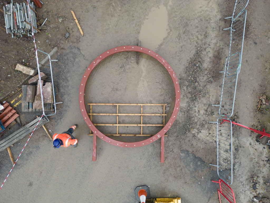 
    A new circular steel frame to hold the historic ‘Rose Window’ ready to be lifted by crane (Credit: High Life Highland / Ewen Weatherspoon)
    